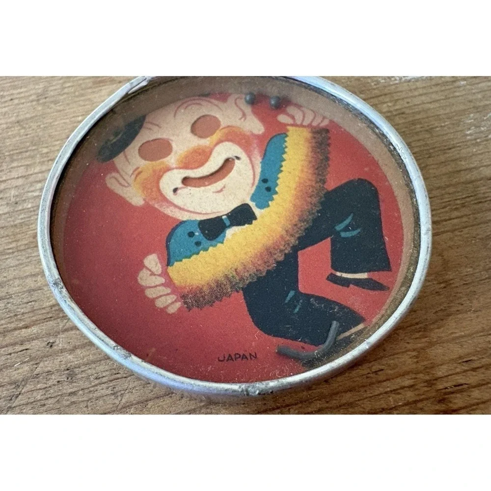 Vintage hand held dexterity puzzle clown playing accordian mirror back Japan 2